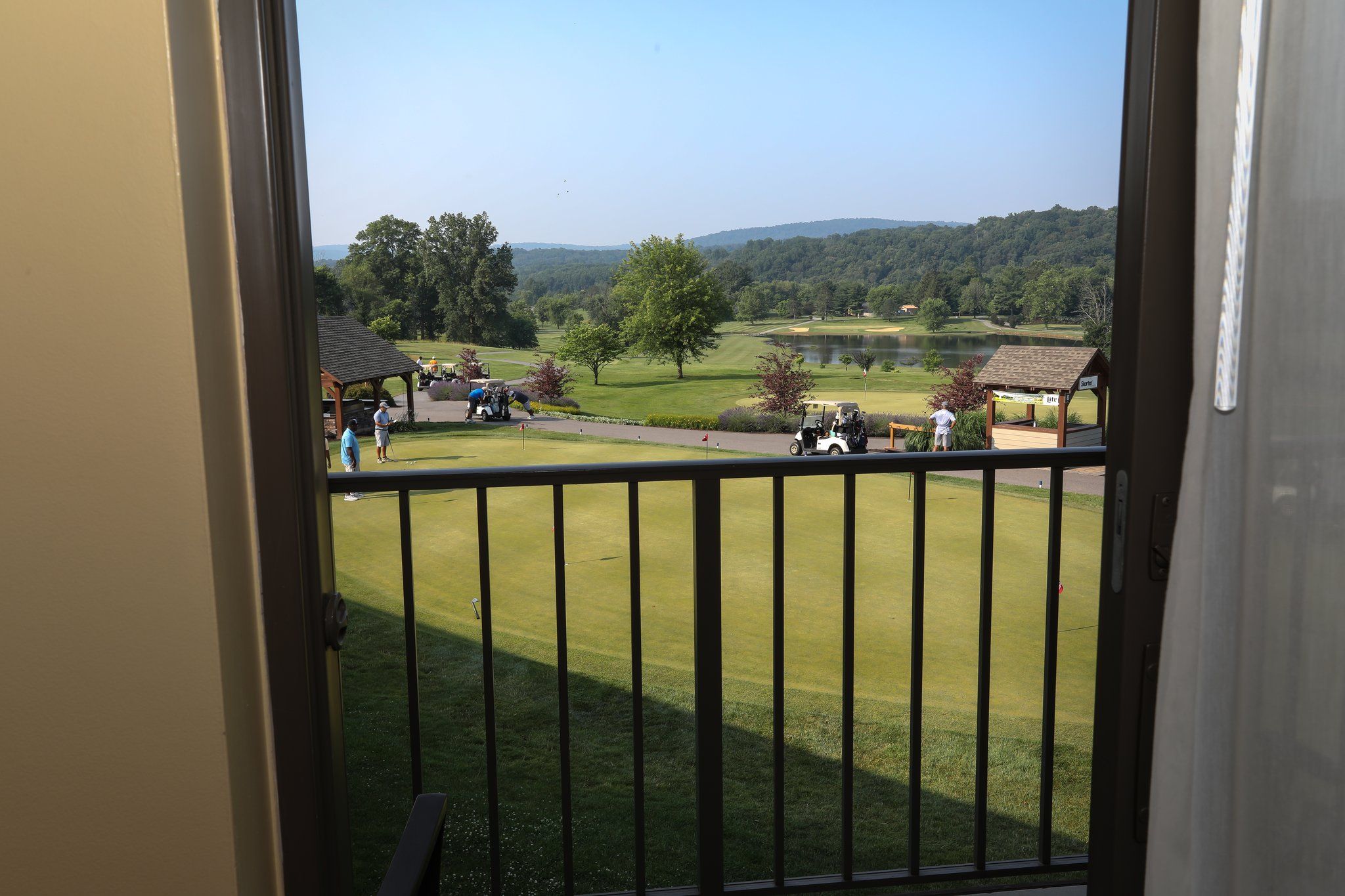 image Enjoy serene views of the golf course right from your private balcony.