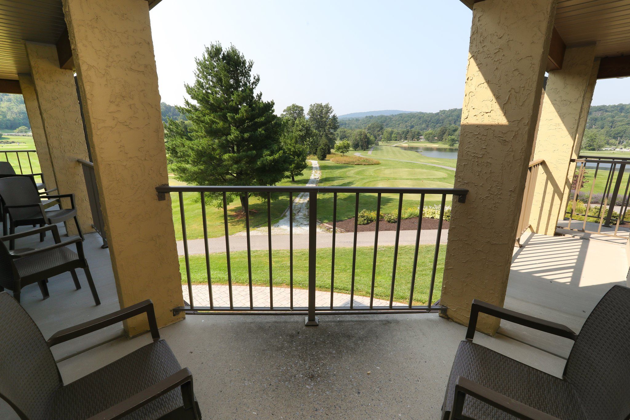 image Private balcony with outdoor seating and beautiful views, perfect for enjoying the fresh air.