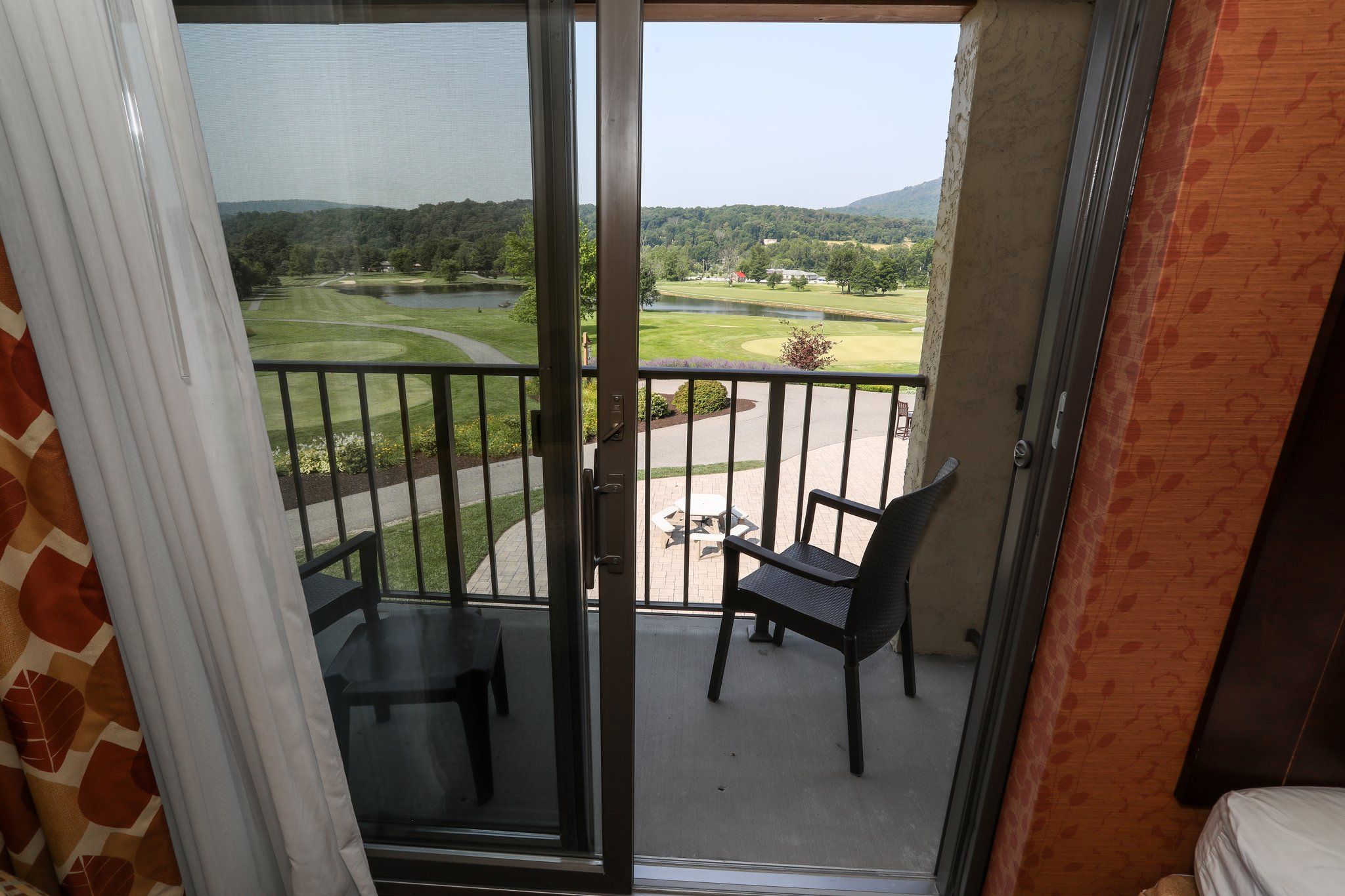 image Private balcony with seating and beautiful views of the surrounding golf course.