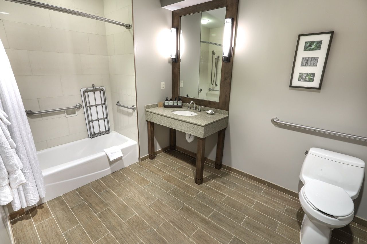 image Clean and spacious bathroom with modern amenities, offering comfort and convenience.