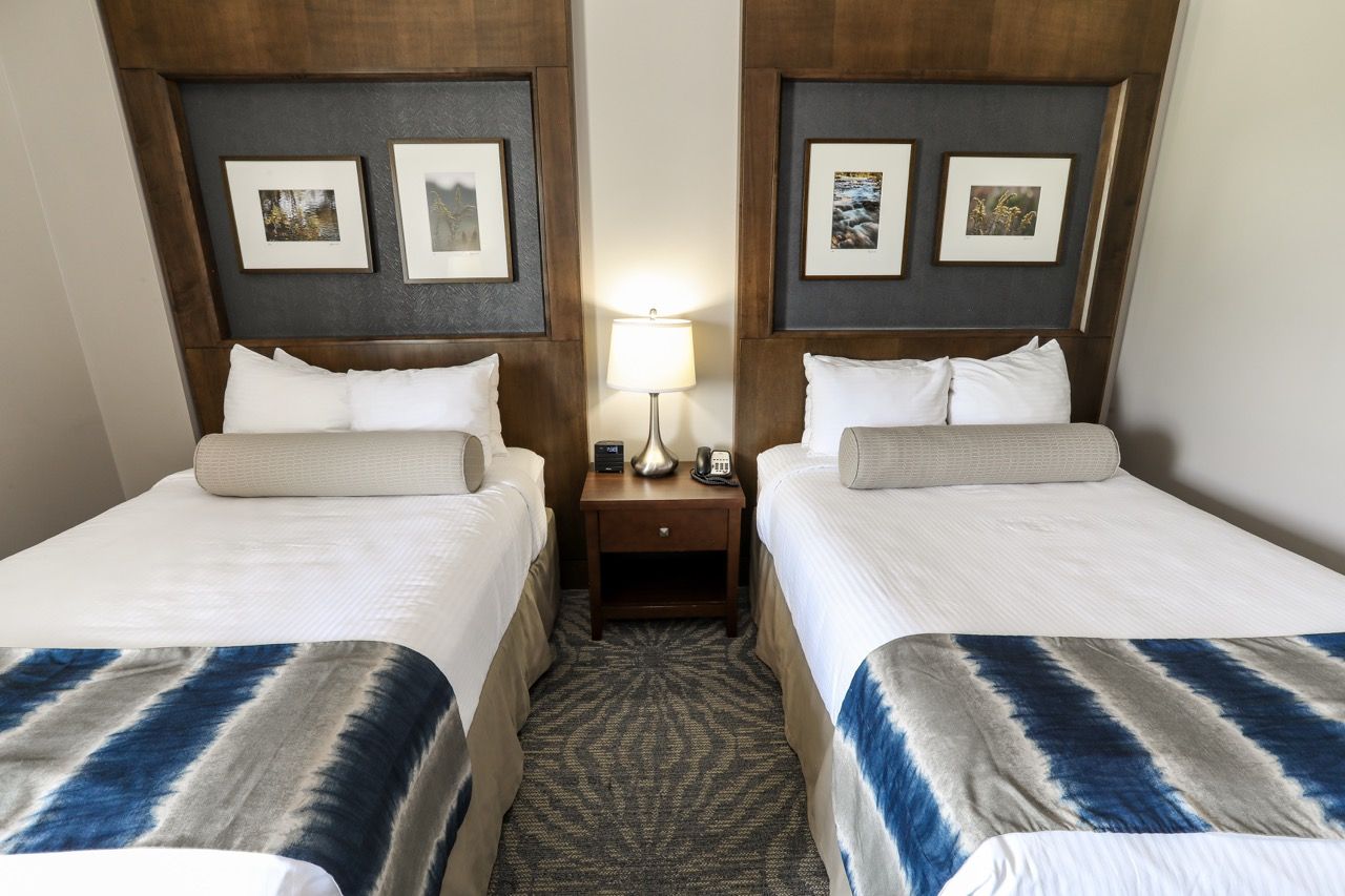 image Comfortable room with two cozy beds and modern décor, perfect for a relaxing stay.