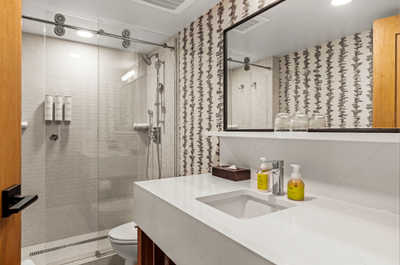 Stylish bathroom with a spacious walk-in shower and modern fixtures for a refreshing experience.