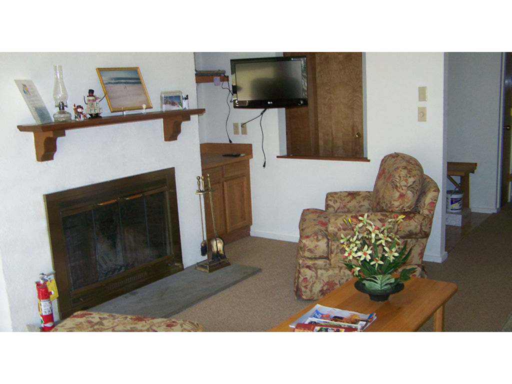 image Warm up by the cozy fireplace in the living area, creating a perfect atmosphere for chilly evenings.