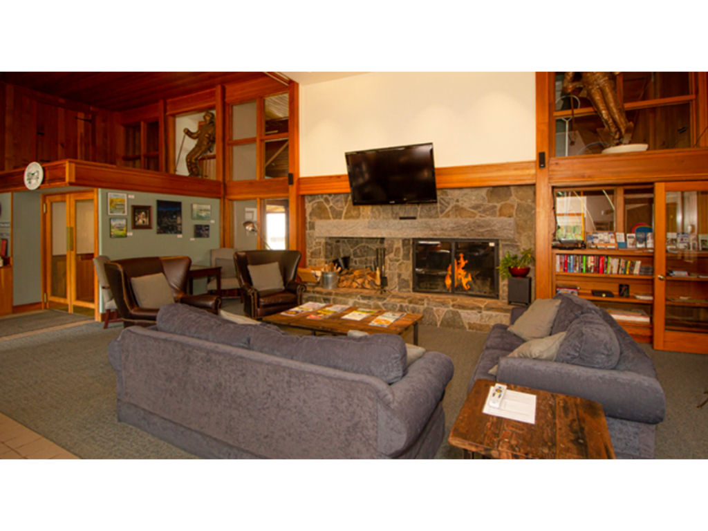image Inviting lounge area with a cozy fireplace and a warm, rustic feel, ideal for unwinding after a busy day.