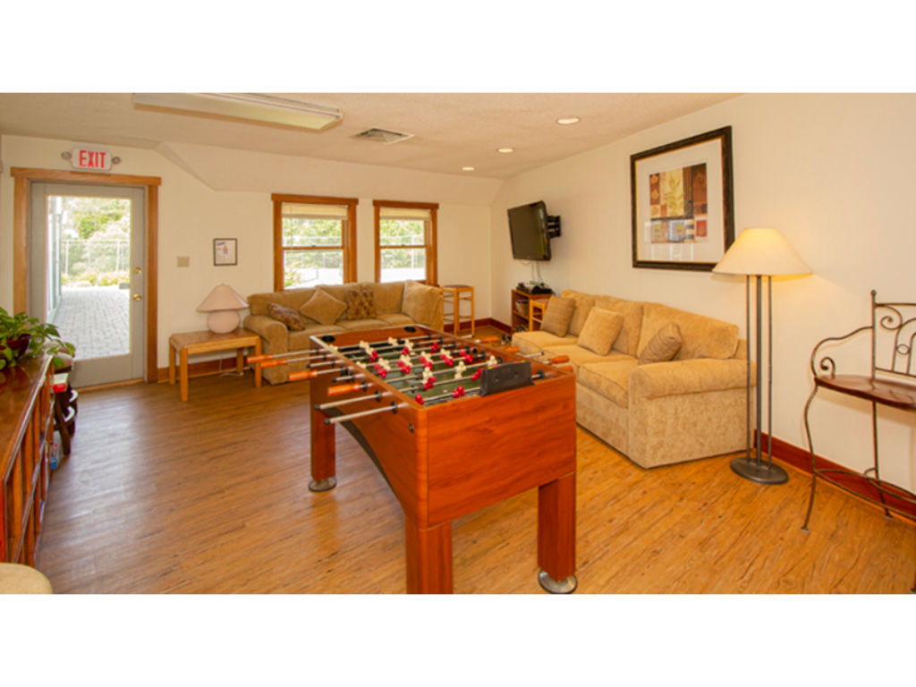 image Open living room with comfortable seating and plenty of natural light, perfect for quality time with loved ones.