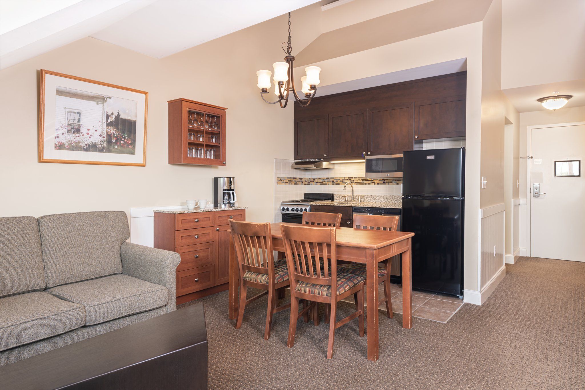 image The kitchen and dining space exude a warm and welcoming vibe, encouraging shared meals and delightful conversations around the table.