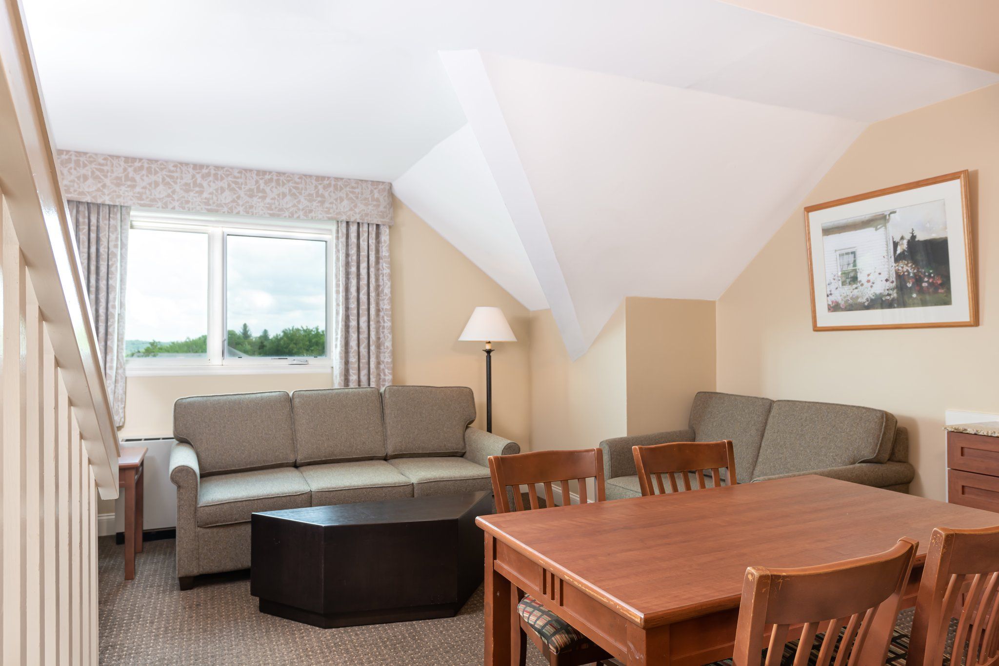 image Relax and connect in the inviting living and dining area, designed to make you feel at home with its cozy furnishings and welcoming atmosphere.