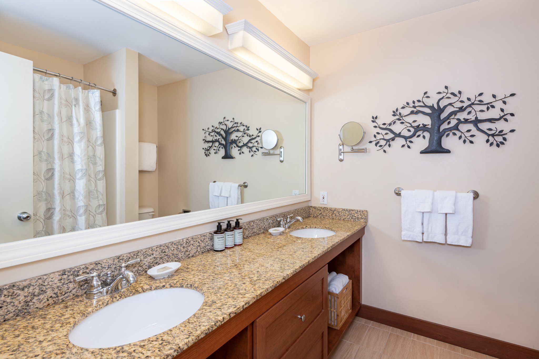 image Start your day refreshed in this bright and spacious bathroom, where the airy design and thoughtful layout make getting ready feel like a breeze.