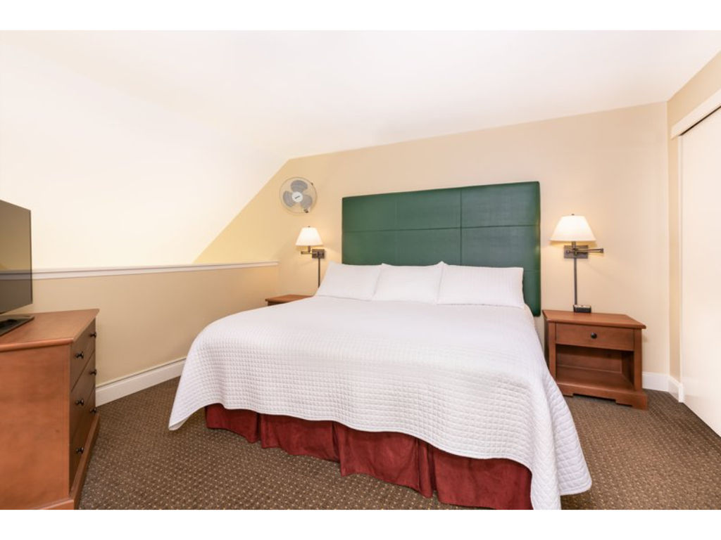 image Thoughtfully designed for relaxation, this welcoming bedroom is the perfect place to recharge.