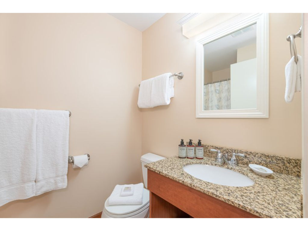 image A well-appointed bathroom with warm lighting and modern touches adds to the comfort of your stay.