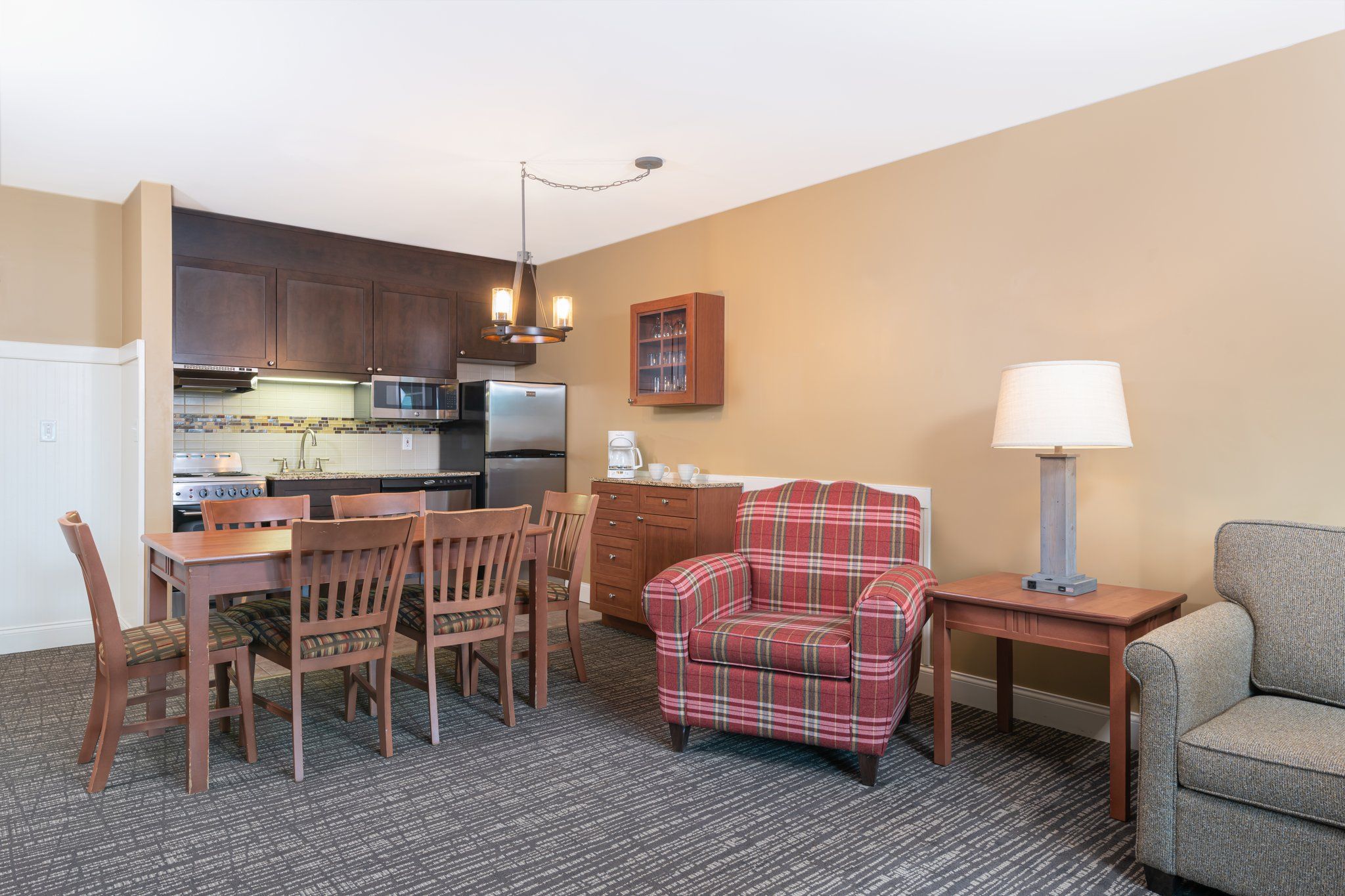 image Enjoy a home-cooked meal or gather for conversation in the spacious dining and living area, complete with a warm and inviting atmosphere.