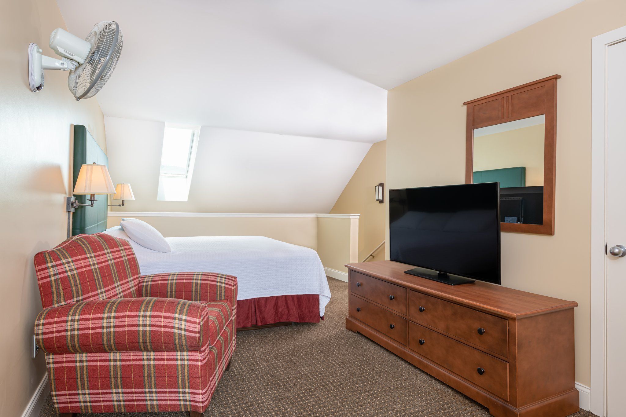 image A peaceful bedroom retreat with ample natural light and a soft, inviting bed—your perfect spot to recharge.