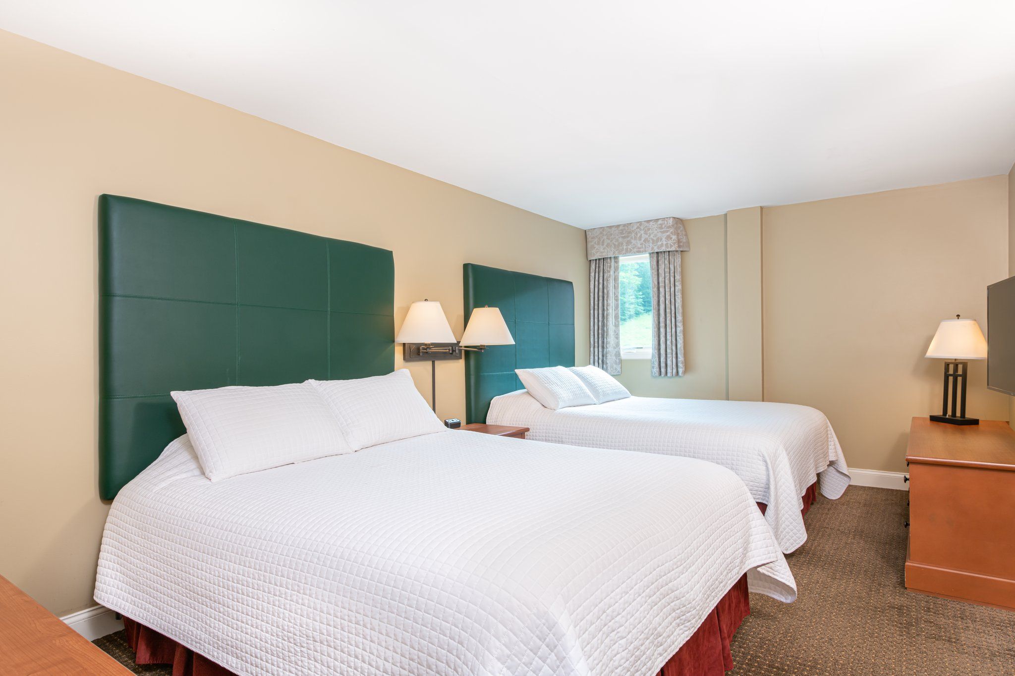 image Tranquil bedroom with a calming ambiance and ample natural light, creating a serene atmosphere for rest.