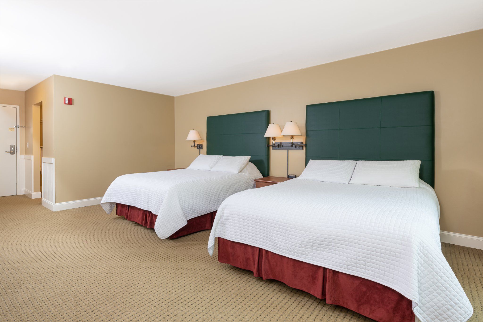 image Comfortable sleeping arrangement in a roomy setting, perfect for families or groups seeking a restful stay.