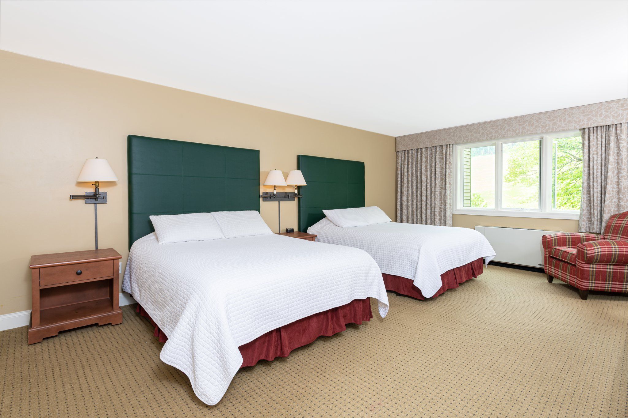 image Spacious bedroom with a serene ambiance and natural light, offering a tranquil retreat for rest and relaxation.