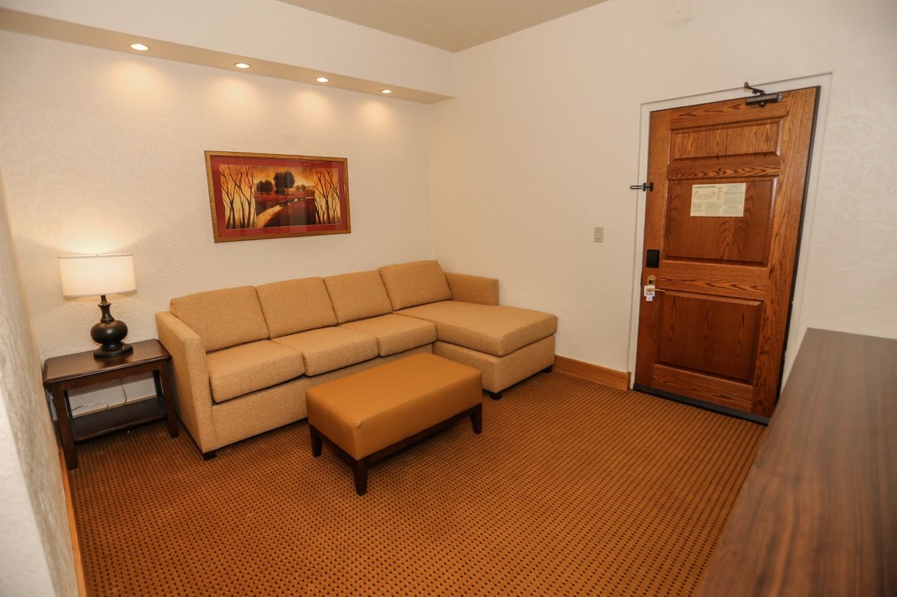 image Stylish living space featuring a comfortable sofa, soft lighting, and tasteful decor for a relaxing retreat.