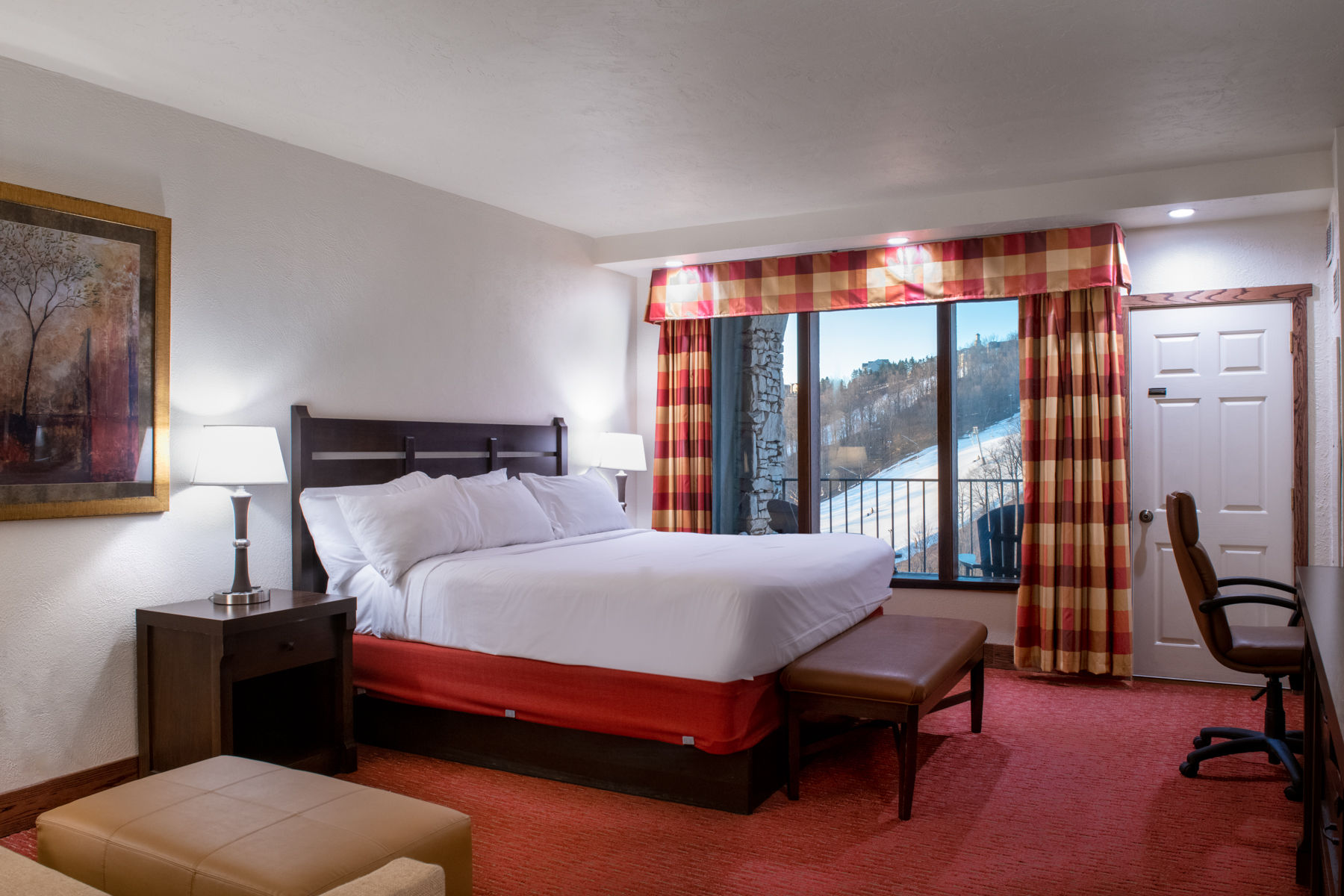 image Spacious bedroom with large windows, natural light, and elegant decor that creates a peaceful retreat.