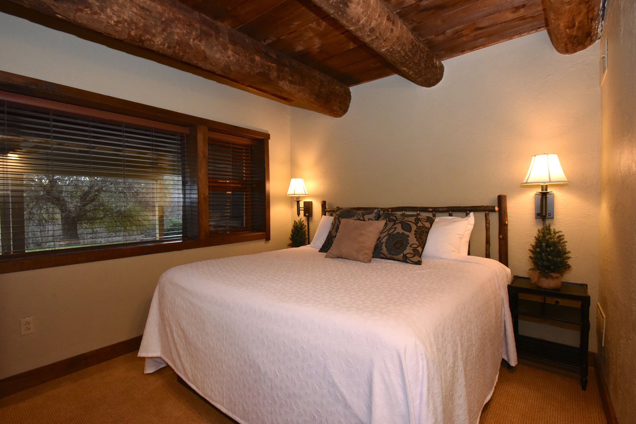 image Inviting bedroom with wooden details, offering a blend of comfort and rustic charm.