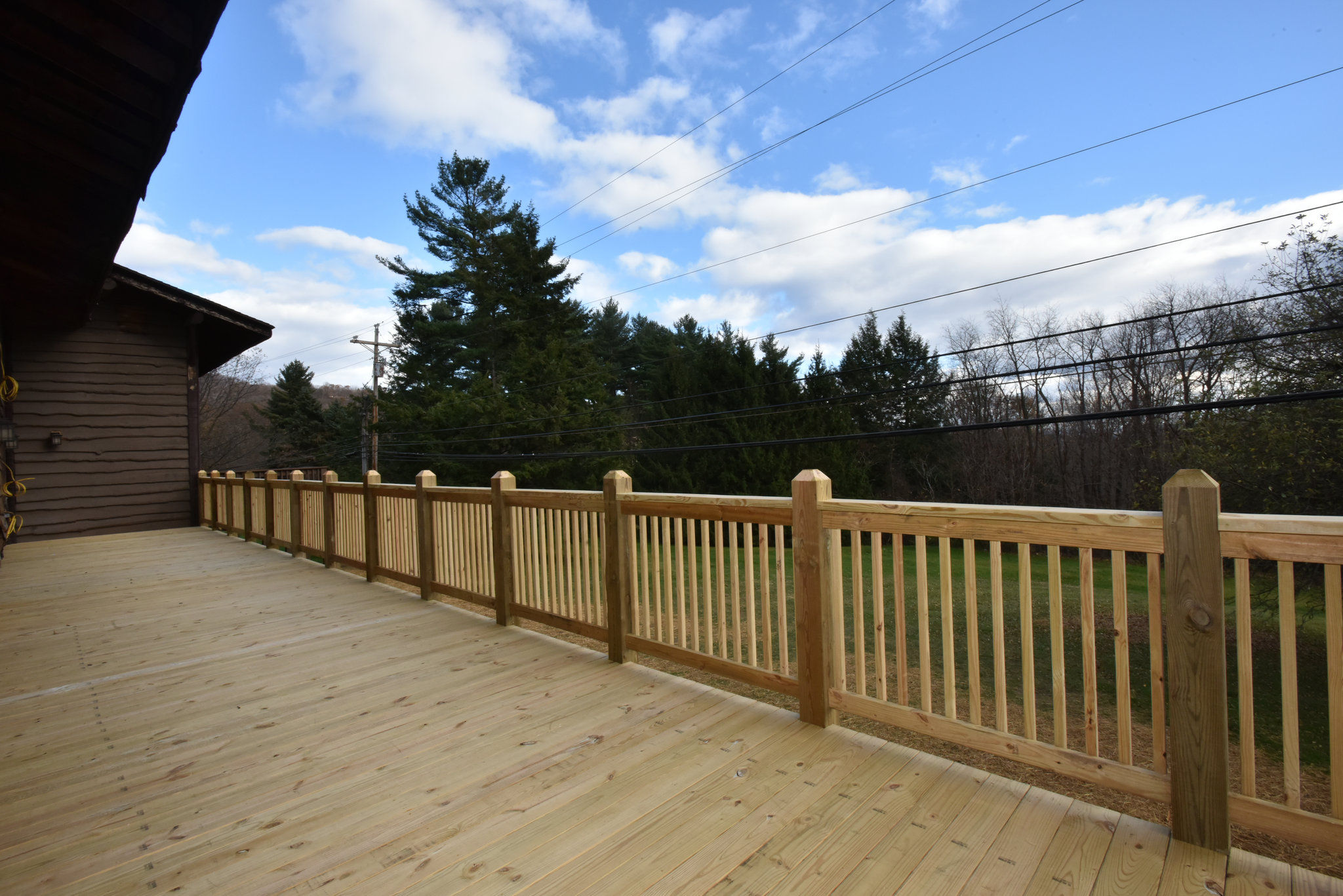 image Expansive deck with scenic views, perfect for enjoying the outdoors and taking in the fresh air.