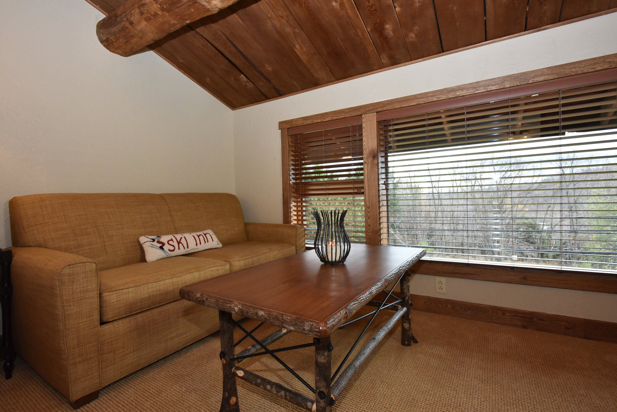 image Comfortable seating area with natural light filtering in, ideal for a quiet afternoon.