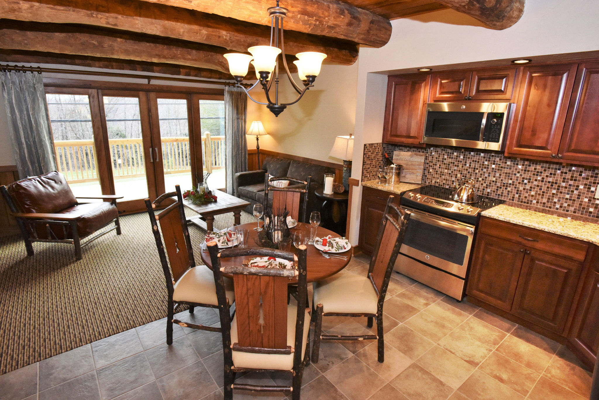 image  Bright kitchen and dining space with rustic accents, offering a welcoming atmosphere for family gatherings.
