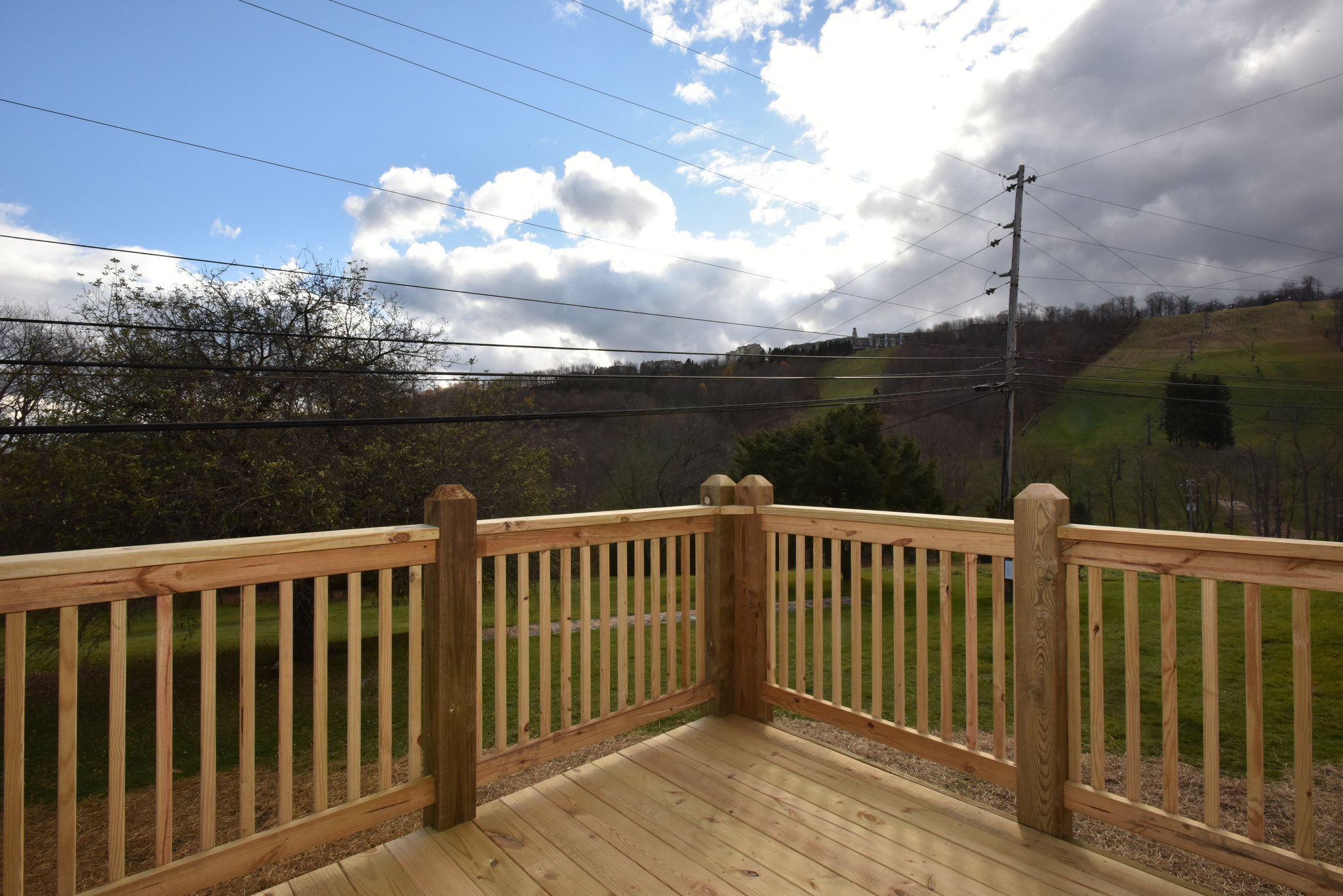 image Scenic deck with stunning views of the surrounding landscape, ideal for enjoying a peaceful morning or evening outdoors.