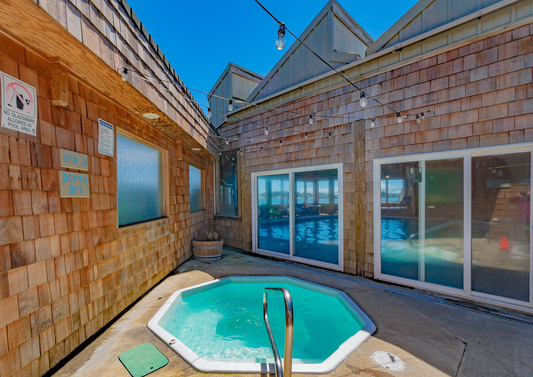 image Relax and recharge in this private outdoor hot tub, nestled within a charming courtyard setting for the perfect end to your day.