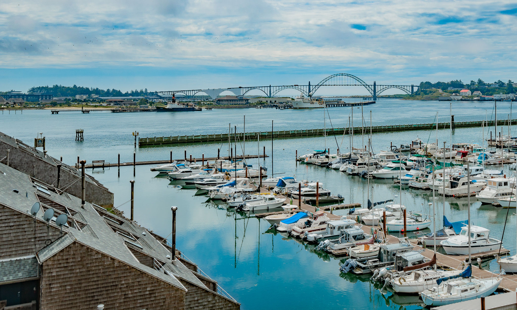 image Overlook the vibrant marina from the comfort of your suite, with boats gently swaying in the calm waters below.