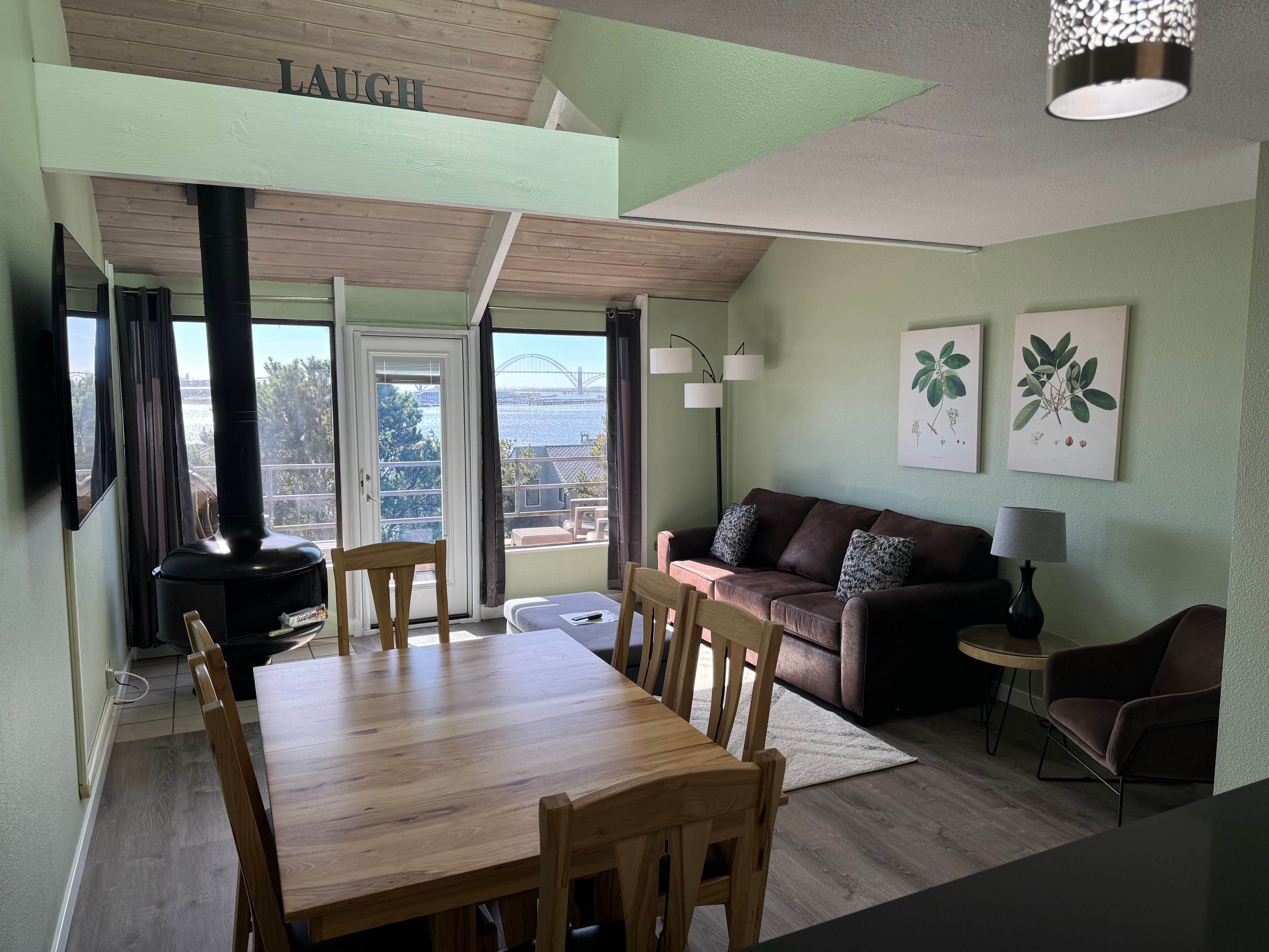 image A bright, open living and dining area with plenty of natural light, perfect for gathering or relaxing.