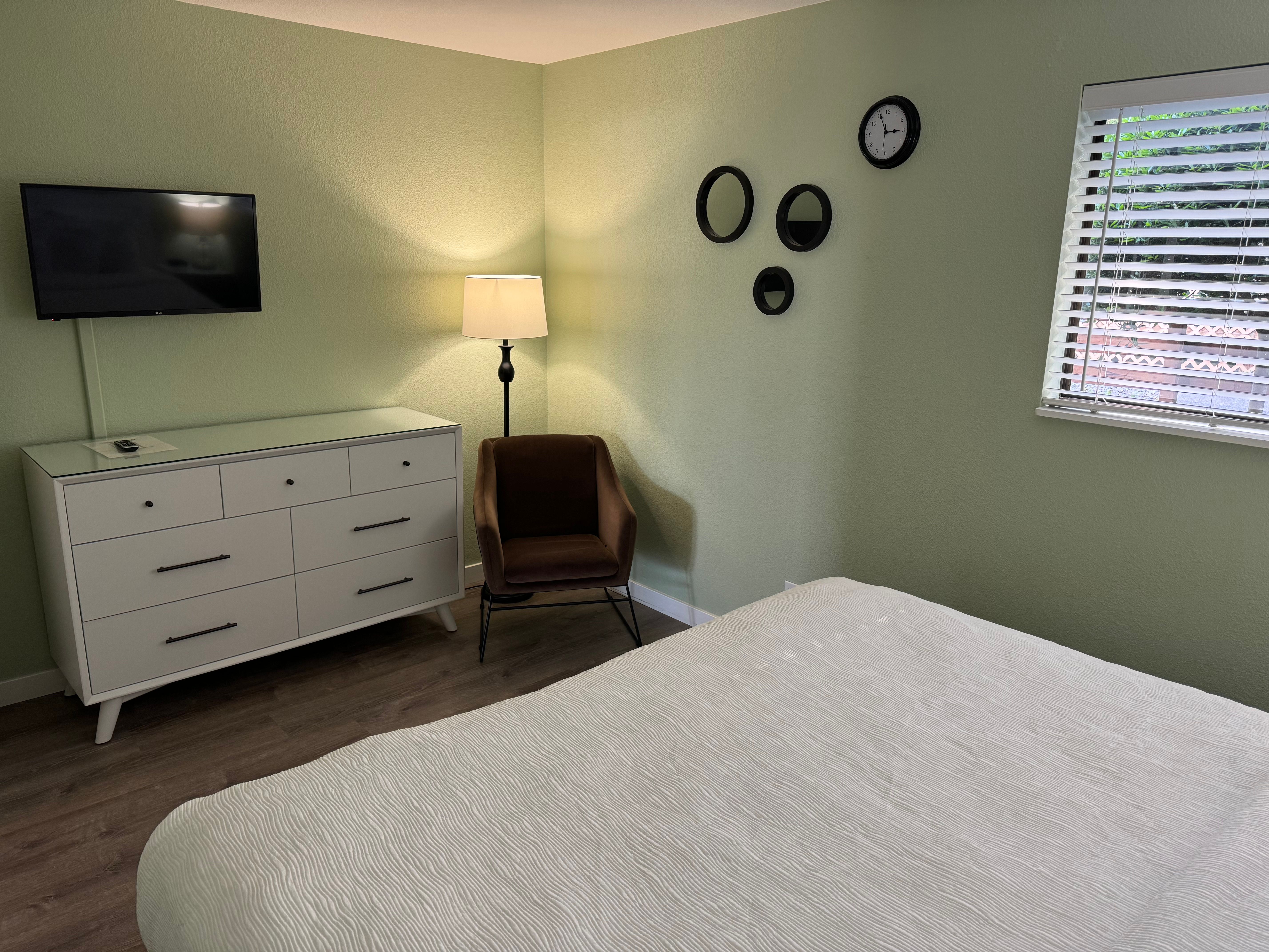 image This comfortable bedroom offers a peaceful retreat with soft lighting and cozy furnishings.