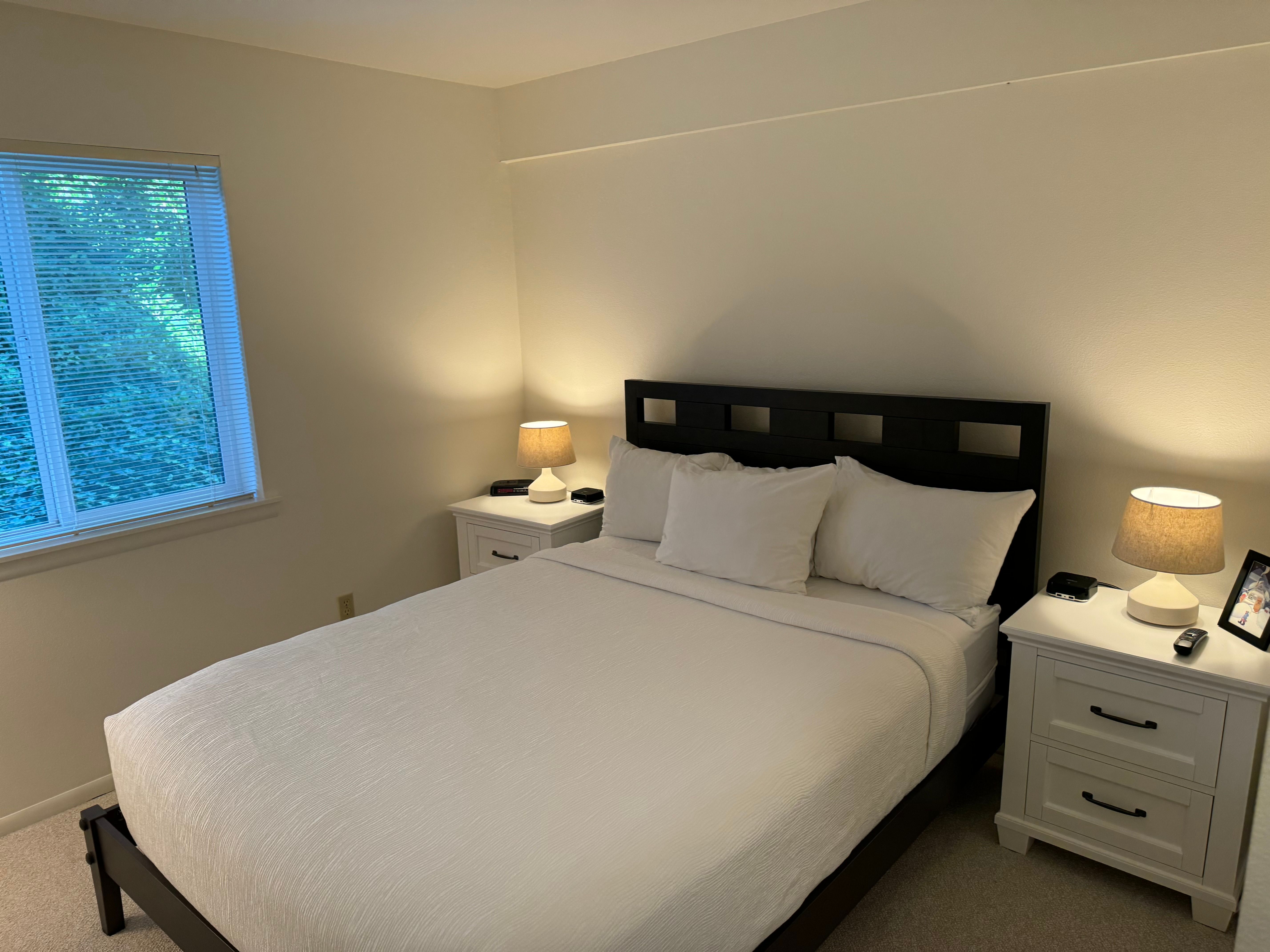 image Rest peacefully in this cozy bedroom, where soft lighting and a serene atmosphere create a restful retreat.