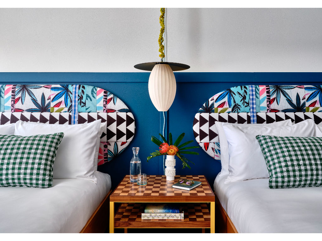 image Playful patterns and bold colors bring energy to this cozy room, offering a delightful space to rest and recharge.