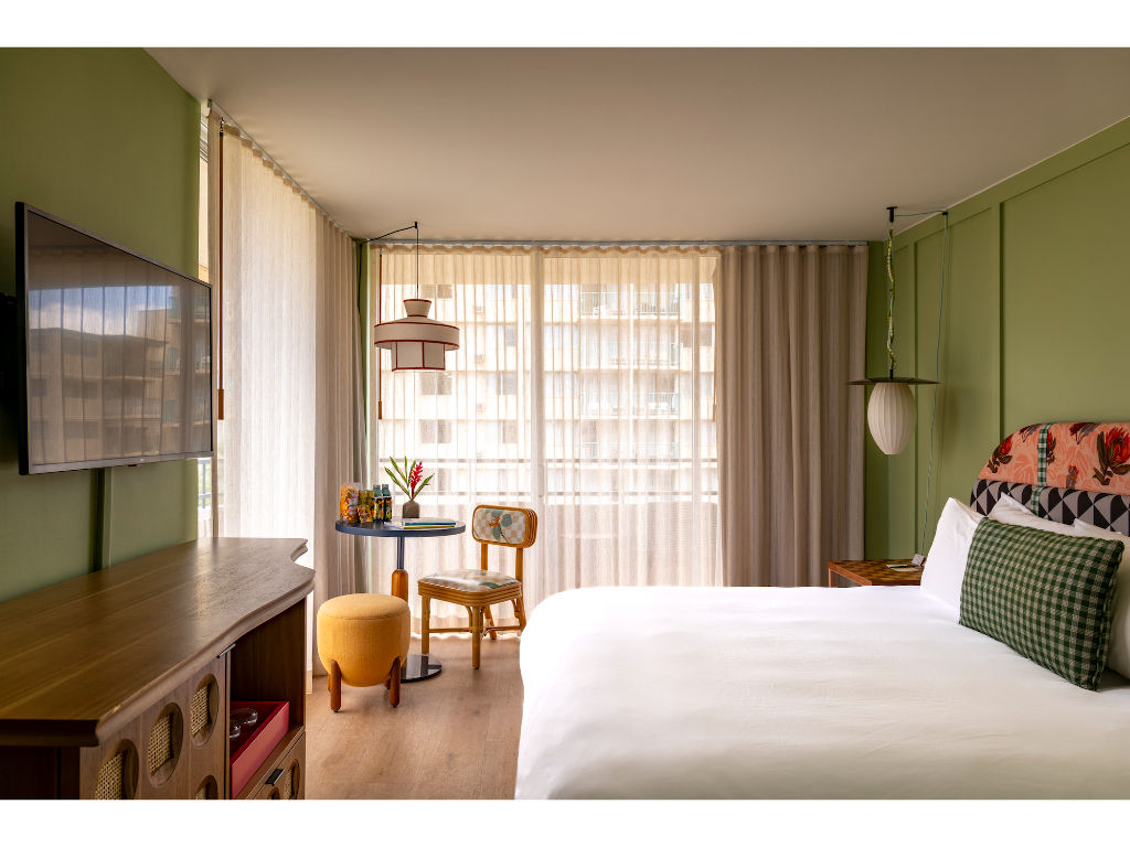 image The large windows invite ample sunlight into this warm and inviting room, making it an ideal spot to relax and recharge.