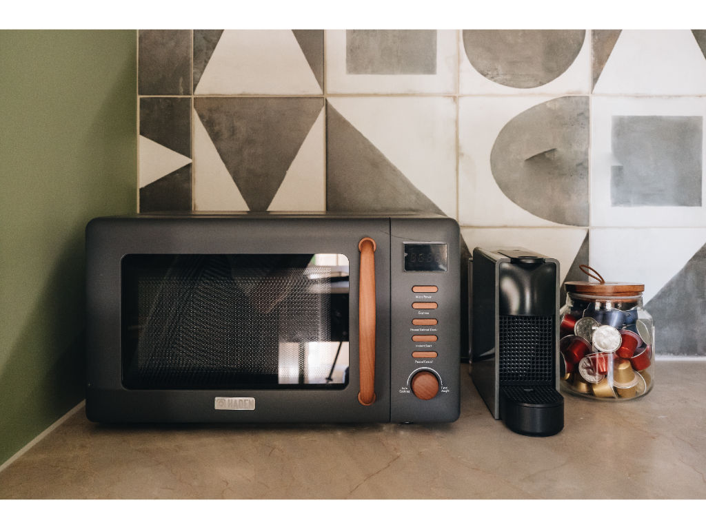 image A modern, sleek corner with everything you need for a quick bite, blending convenience with stylish design.