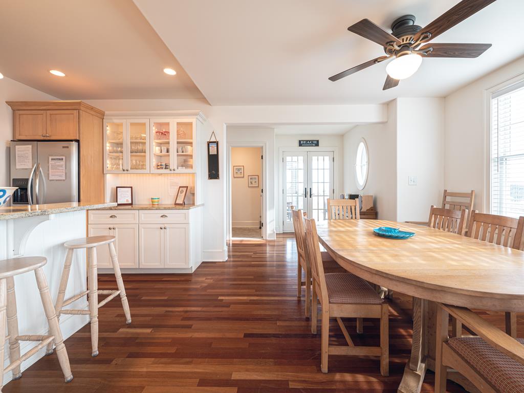 image Spacious kitchen with modern appliances and bar seating, making meal prep and casual dining a breeze.