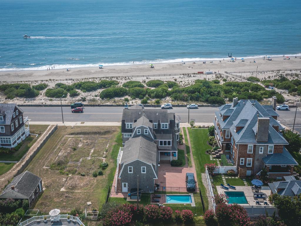 image Stunning aerial shot highlighting the home’s beachfront location and surrounding scenic beauty.
