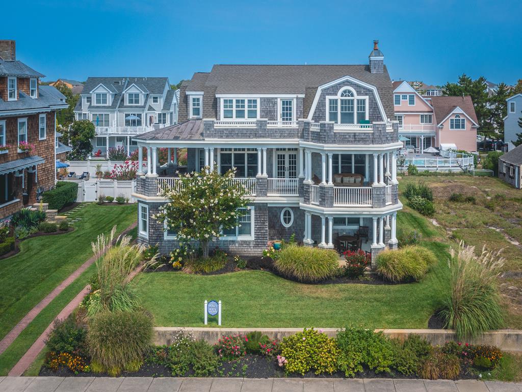 image Enjoy breathtaking ocean views from this 5-bedroom unit occupying the second and third floors of a stunning beachfront home in Cape May.