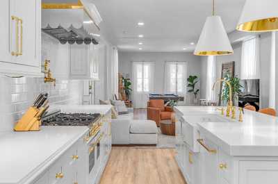 Open-concept kitchen flowing seamlessly into the living room, perfect for entertaining and relaxing.