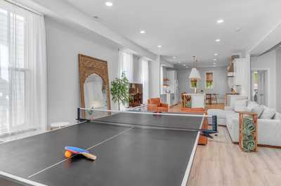 Spacious game area with a ping pong table, offering hours of entertainment for guests of all ages.