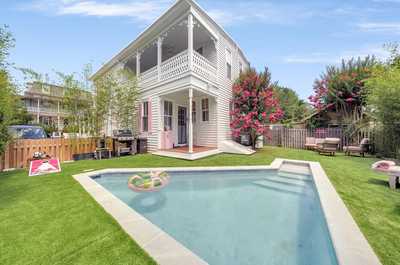 Private backyard featuring a sparkling heated pool and lush landscaping for your personal retreat.