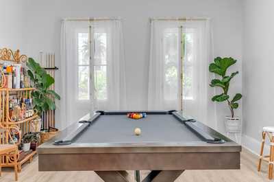 Enjoy a game of pool in the dedicated game room, perfect for fun-filled evenings with family and friends.