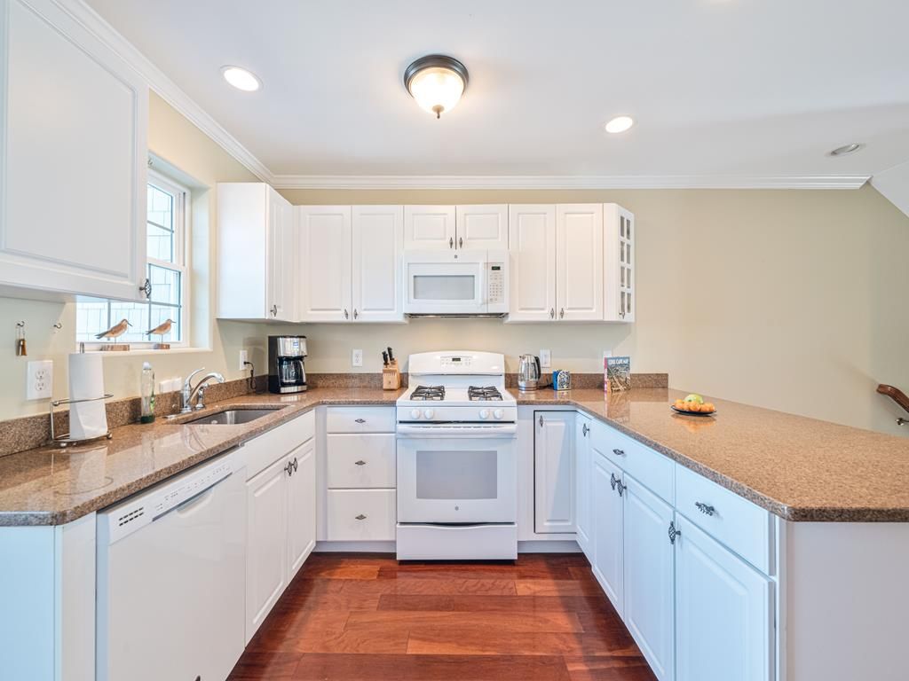 image Spacious kitchen with ample counter space, modern appliances, and all the essentials for preparing delicious meals.