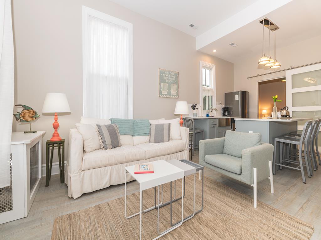 image Step into the bright and open living area featuring cozy seating, modern decor, and an inviting atmosphere.