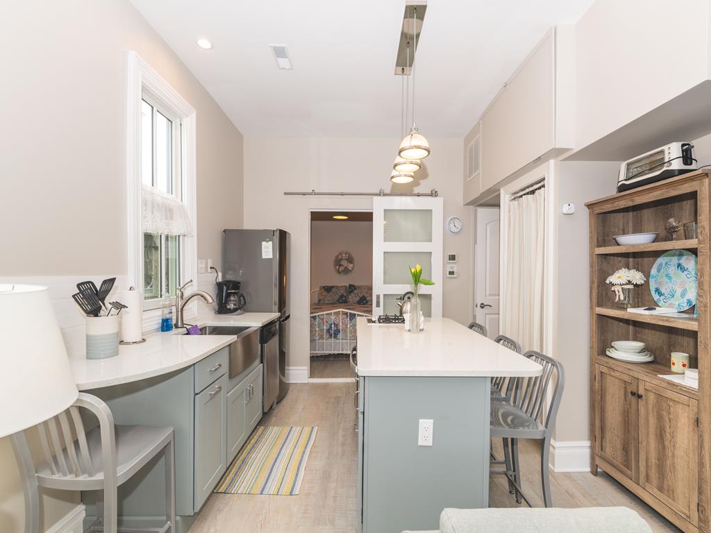 image Fully equipped kitchen with modern appliances and ample counter space – ideal for preparing meals after a day at the beach.