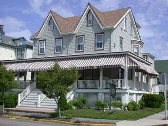 image Beautiful exterior of this Cape May historic home, featuring classic architecture and inviting charm.