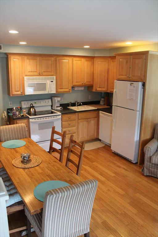 image Spacious kitchen with modern appliances and a dining area ideal for family meals.
