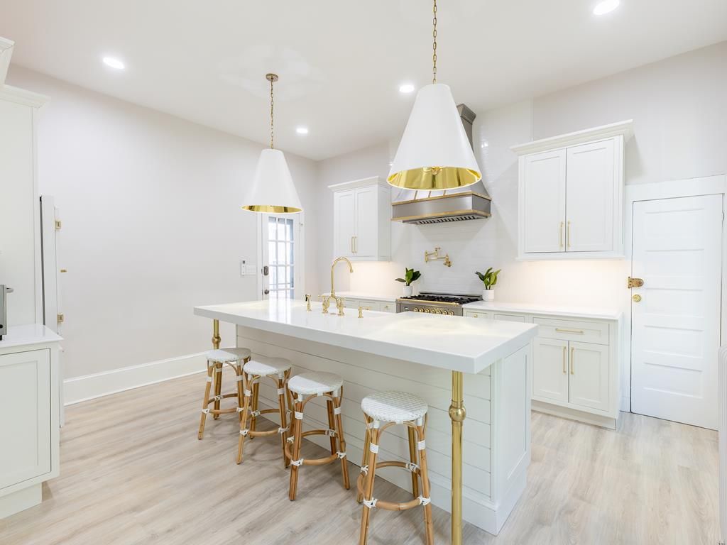 image The spacious, fully equipped kitchen features a large island with seating, making it ideal for cooking and gathering with family and friends.