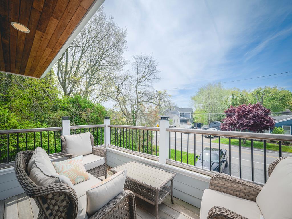 image Another angle of the scenic deck with comfortable outdoor furniture for relaxation.