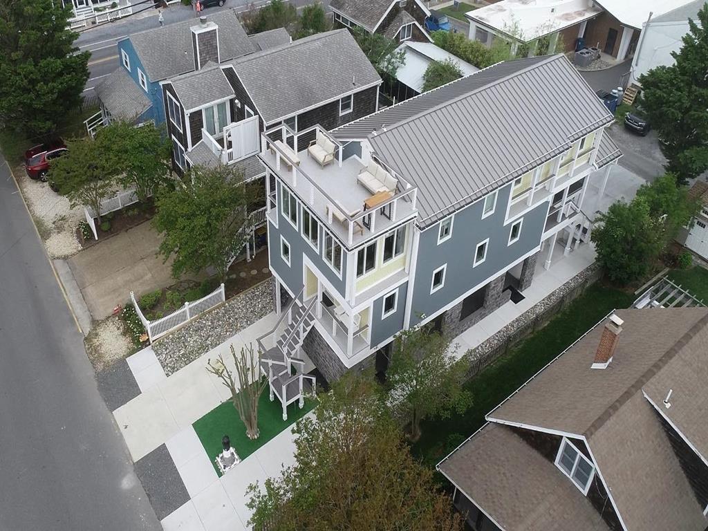 image An aerial view of the home's vibrant design and spacious layout, showcasing its charming location in the heart of the beach block neighborhood.