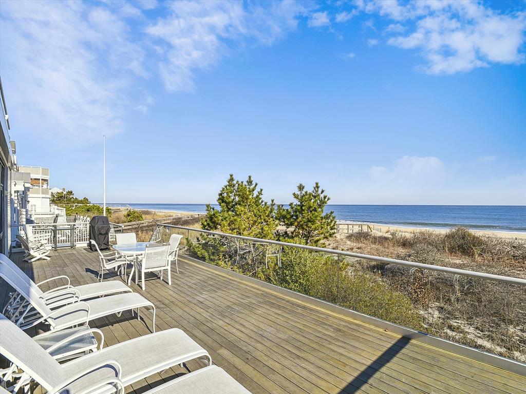 image Breathtaking views of the dunes and ocean from the deck, creating the ultimate coastal retreat.
